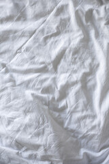 Fototapeta na wymiar Wrinkled white blanket as a background