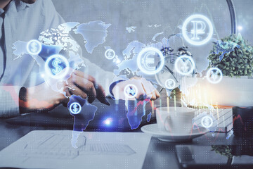 Double exposure of man's hands holding and using a phone and financial graph drawing. Analysis concept.
