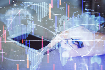 Double exposure of business theme sketch hologram and woman holding and using a mobile device.