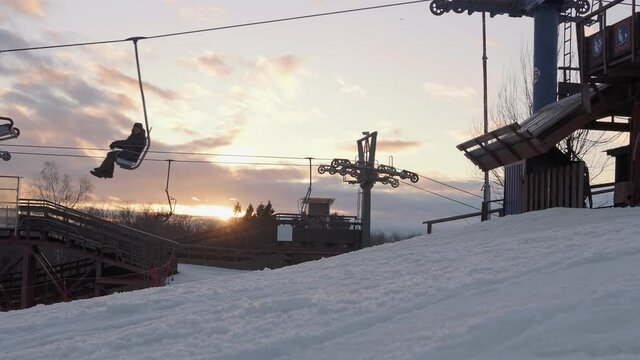 A ski lift for transporting skiers and snowboarders on a snow-covered ski slope. Stepanovo, Moscow region.