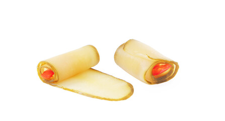 Snack Zucchini roll with paprika isolated on white background