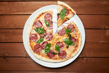 italian pizza salami with chees on the plate