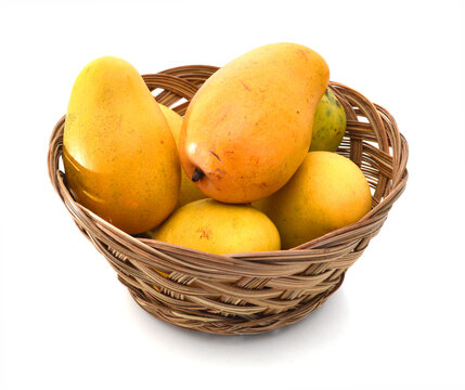 Yellow mango isolated in basket on a white background