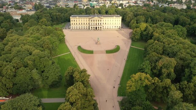 Oslo, Norway,Scandinavia. Beautiful 4K panoramic aerial video from flying drone to of the Royal Palace and Statue of King Karl Johan Oslo. In the background the castle park, the city and the mountains