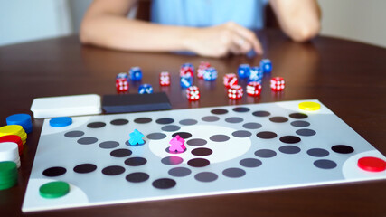 Fototapeta premium woman people playing fun board game on wooden table top selected focus