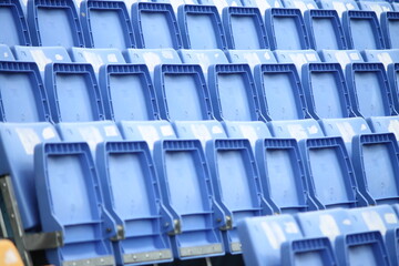 The colorful seats in a football stadium