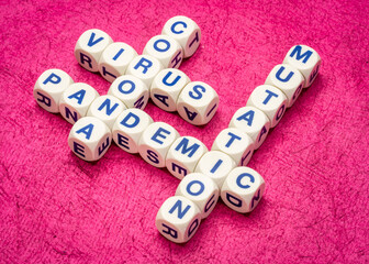 coronavirus pandemic and mutations crossword in dice letters against textured handmade paper,...