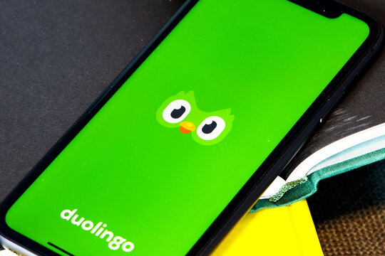 Duolingo app displayed on smart phone. Duolingo is an American language-learning website and mobile app, as well as a digital language-proficiency assessment exam. 