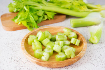 Fresh celery stalks cut into pieces for cooking