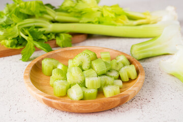 Fresh celery stalks cut into pieces for cooking