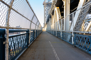 Empty Manhattan Bridge Walkway in New York City. Suspension bridge that connects Manhattan with Brooklyn with walking path, subway tracks and car roads