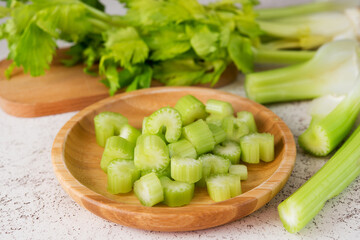 Fresh celery stalks cut into pieces for cooking