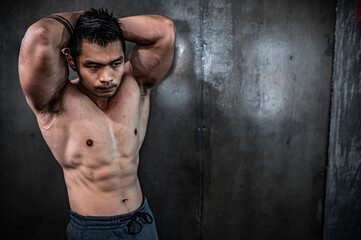 Fototapeta premium Portrait of asian man big muscle at the gym,Thailand people,Workout for good healthy,Body weight training,Fitness at the gym concept