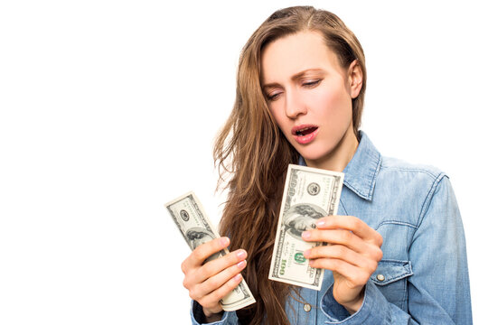 Young woman holding dollars in her hand