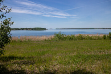 Panorama of renaturized brown coal open pit landscape with the lake Grosser Goitzschesee near the town of Bitterfeld, Germany, Europe
