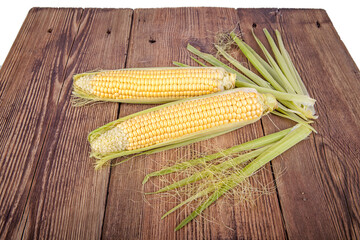 Corn on the cob on a wooden background. View from another angle in the portfolio.