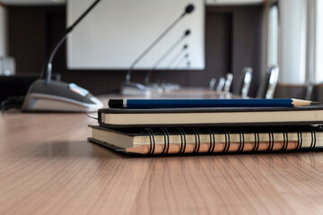 Close up two pencil and notebook on table in meeting room