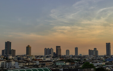 Fototapeta premium Aerial view of Beautiful scenery view of Skyscraper Evening time before Sunset creates relaxing feeling for the rest of the day. Selective focus.