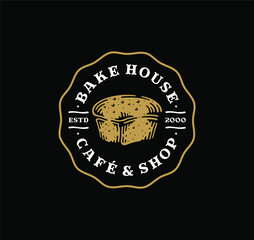 Logo badge of loaf bread in vintage design. bakery label design on black background