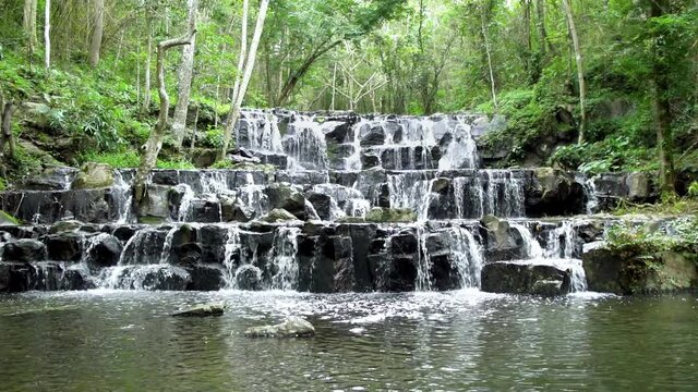 Beautiful waterfall in tropical forest at Namtok Samlan National Park, Saraburi, Thailand - Slow Motion