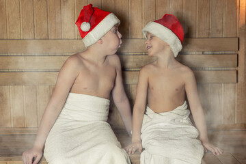 Fototapeta premium Сhildren relaxing in sauna. Concept of: relax, vacation,healthy lifestyle.