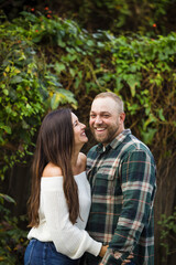 A young couple in their thirties is outdoors
