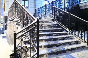 Snow covered stairs of building