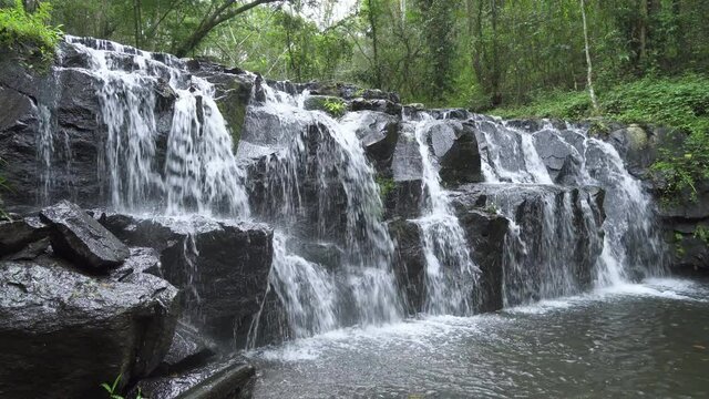 Beautiful waterfall cliff in tropical forest at Namtok Samlan National Park, Saraburi, Thailand