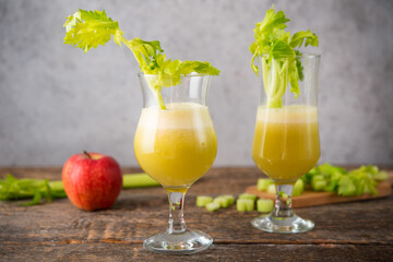 Fresh juice apple and celery in a clear glass, vegetarian food, clean food