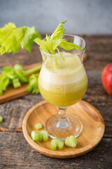Fresh juice apple and celery in a clear glass, vegetarian food, clean food