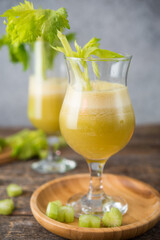 Fresh juice apple and celery in a clear glass, vegetarian food, clean food