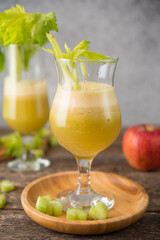 Fresh juice apple and celery in a clear glass, vegetarian food