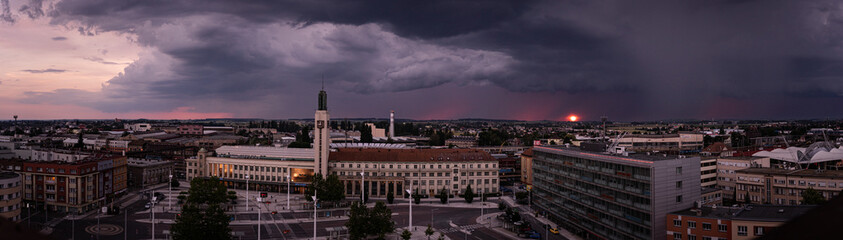 Fototapeta na wymiar panorama view of city with storm and sunset
