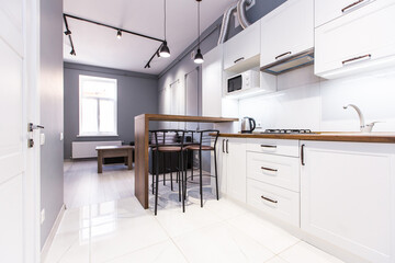 interior photography, kitchen studio in modern loft style in bright colors with furniture