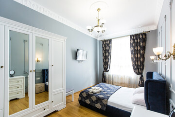 Photo of the interior of the bedroom, a large bed, in white, in a modern style