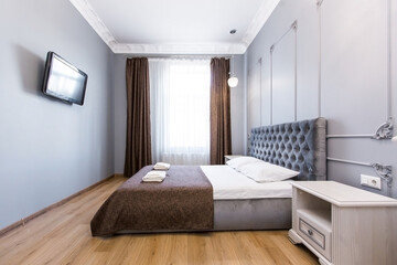 Photo of the interior of the bedroom, a large bed, in white, in a modern style