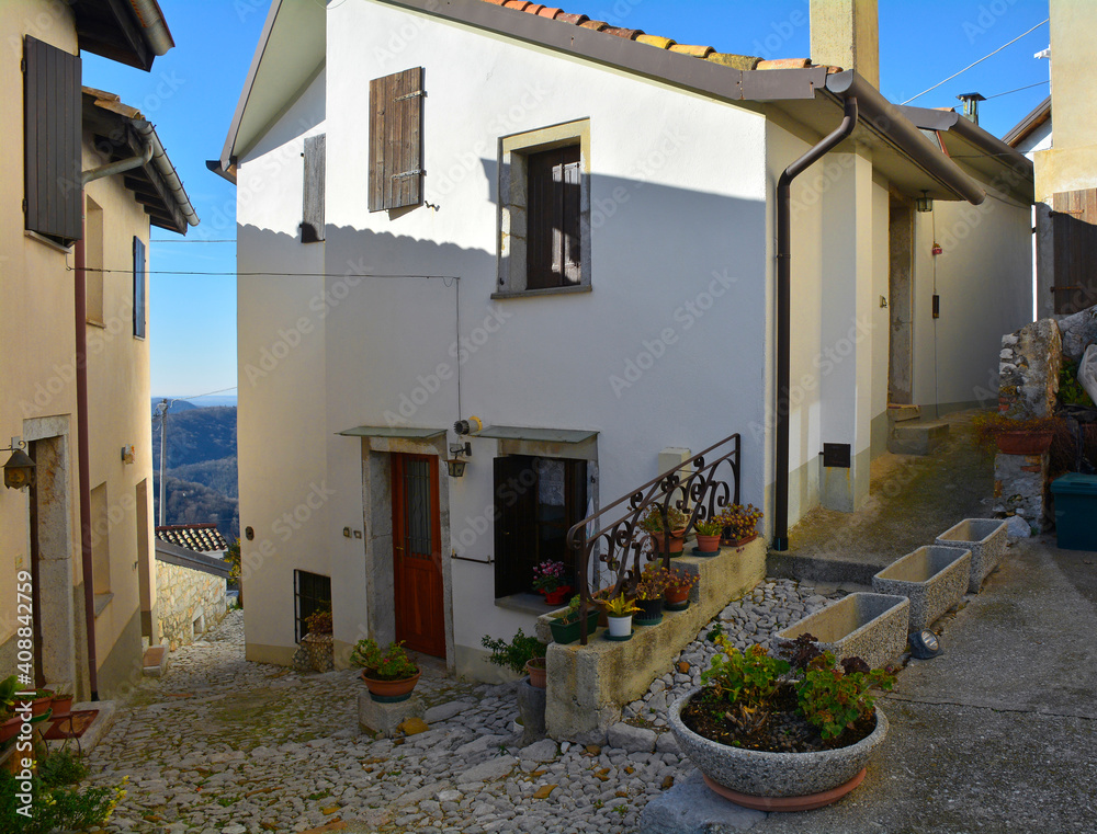 Wall mural a street in the triviat area of the hill village of clauzetto in pordenone province, friuli-venezia 