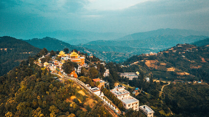 Buddhist monastry and snowcapped peak at background in the Himalaya mountains, Nepal