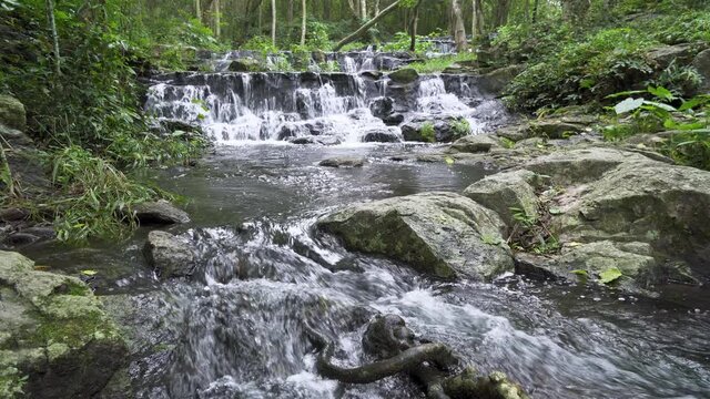 Beautiful stream and waterfall in tropical forest at Namtok Samlan National Park, Saraburi, Thailand