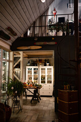 evening in a country house. The kitchen is lit and decorated for the new year.