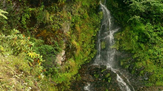 Small waterfall in Himalayan mountains in Nepal
