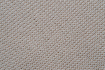 Beige knit background with diagonal pattern