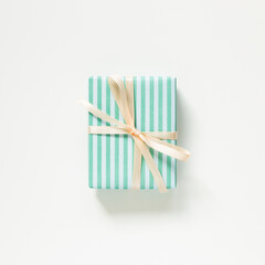 Green stripe pattern gift box isolated on white background. top view, copy space