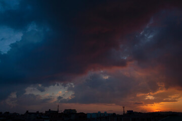 Stunning blue and orange dusk over a bogotá colombia city north neighborhood silhouette. Nature and urban concept