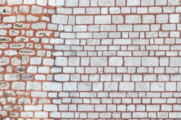 Ancient stone wall. Brick wall background close-up.
