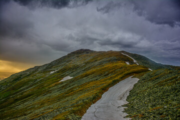 Beautiful mountain landscape with red tent
