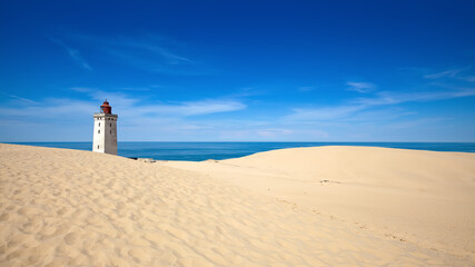 View of the Rubjerg Knude, sand dune and lighthouse at the west coast of Denmark