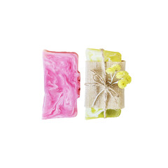 Isolated two bars of handmade rose and herbal soap or dry shampoo with flowers on a white background. Close up of home spa products made from natural ingredients, the best gift and skin care. Top view