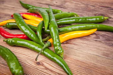 Small peppers on a wooden background. View from another angle in the portfolio.