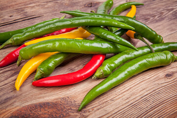 Small peppers on a wooden background. View from another angle in the portfolio.